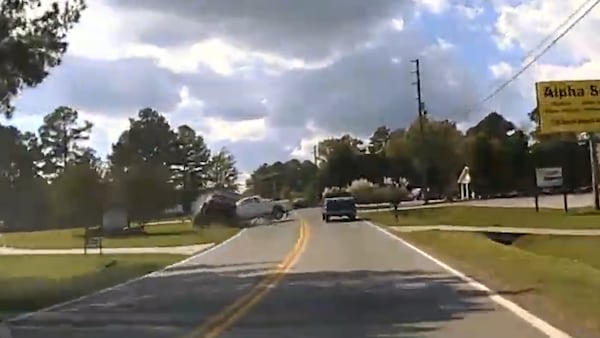 Dashboard camera footage from Trooper Patrick Prosser's cruiser captured the moment that the vehicle he was pursuing in Milledgeville crashed head-on into Jimmy Shackelford's white pickup. (Georgia State Patrol)