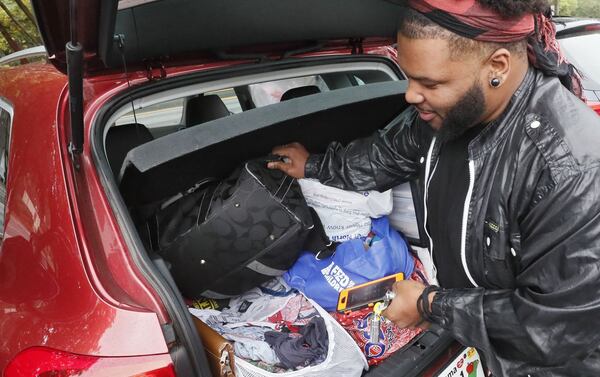 Caleb Hobbs, 29, is currently homeless and stores his essentials in boxes behind the hatch of his SUV. Before his bout with cancer, he had his own apartment where he let others stay when they were down on their luck. BOB ANDRES / ROBERT.ANDRES@AJC.COM