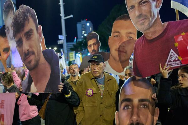 People take part in a protest demanding the immediate release of hostages held by Hamas in the Gaza Strip, in Tel Aviv, Israel, Saturday, March 22, 2025. (AP Photo/Ohad Zwigenberg)