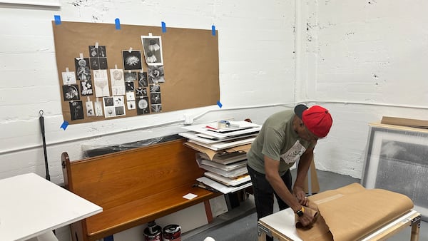 Photographer Gene Dominique packing up his studio at Mint.