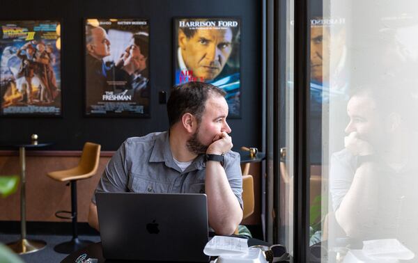 Christopher Escobar, new owner of the Tara Theatre, works inside the Tara in Atlanta on Monday, May 22, 2023. Tara Theatre will reopen on Thursday six months after Regal Cinema abruptly shut it down. (Arvin Temkar / arvin.temkar@ajc.com)