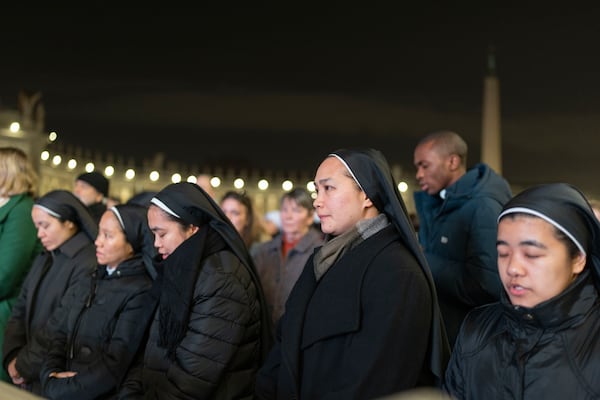 Catholic faithful attend a nightly rosary prayer service for the health of Pope Francis in St. Peter's Square at the Vatican. (AP Photo/Mosa'ab Elshamy)