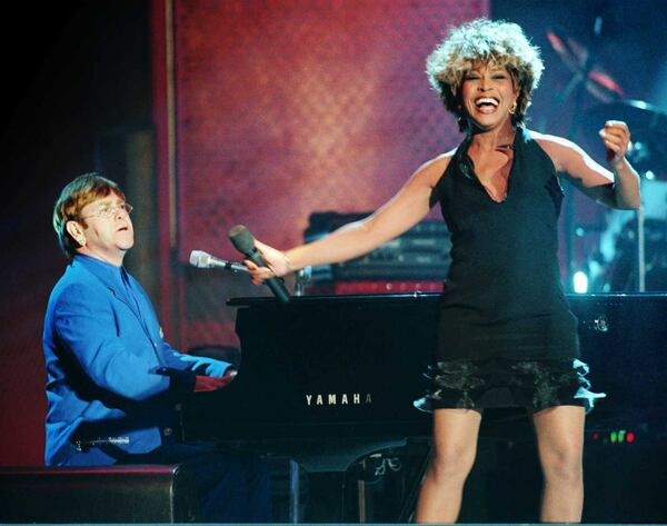 Tina Turner and Elton John perform a duet during the VH1 Fashion & Music Awards show in New York on Dec. 3, 1995. AP PHOTO / ADAM NADEL