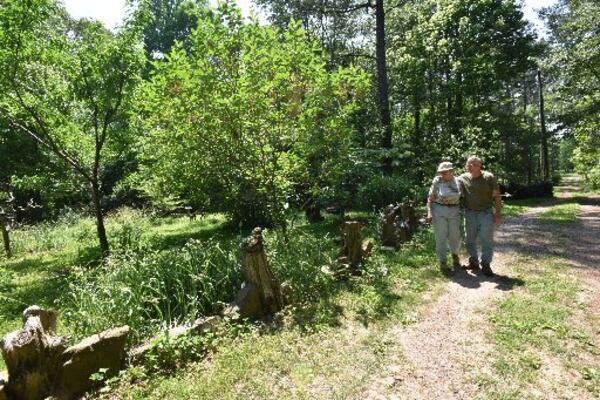 Artists Judy and Tom Touchstone stroll at Turkey Mountain Pottery. HYOSUB SHIN / HSHIN@AJC.COM