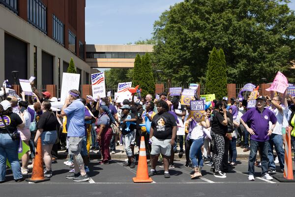 Protesters demonstrate in front of Delta Headquarters during the Airport Workers United march to Delta Headquarters on Saturday, June 3, 2023, in Atlanta. Over 200 protesters marched to demand higher wages. CHRISTINA MATACOTTA FOR THE ATLANTA JOURNAL-CONSTITUTION 