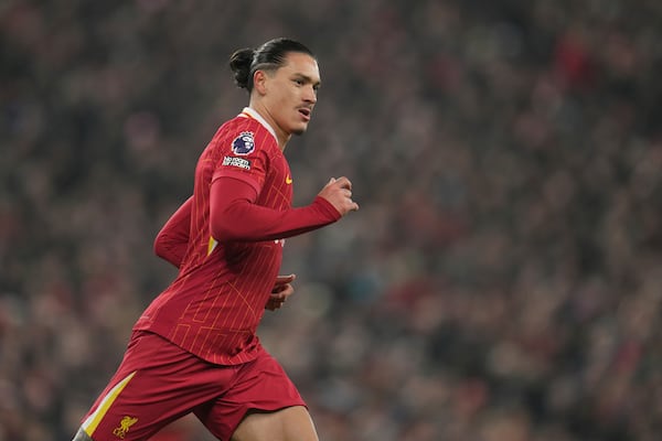 Liverpool's Darwin Nunez runs for a ball during the English Premier League soccer match against Aston Villa at the Anfield stadium in Liverpool, Saturday, Nov. 9, 2024. (AP Photo/Jon Super)