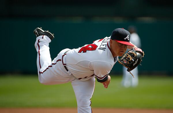 Atlanta Braves starting pitcher Kris Medlen (54) warms up from the mound before the first inning in a spring exhibition baseball game against the Washington Nationals, Tuesday, March 4, 2014, in Kissimmee, Fla. (AP Photo/Alex Brandon) Atlanta Braves starting pitcher Kris Medlen (54) warms up from the mound before the first inning in a spring exhibition baseball game against the Washington Nationals, Tuesday, March 4, 2014, in Kissimmee, Fla. (Alex Brandon / AP)