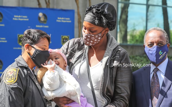 Elizabeth Grisby (right) said DeKalb County police Chief Mirtha Ramos (left) offered her support during the 13 hours 1-year-old Royalty Grisby was missing Thursday. DeKalb County CEO Michael Thurmond (far right) offered all available resources, according to the chief.