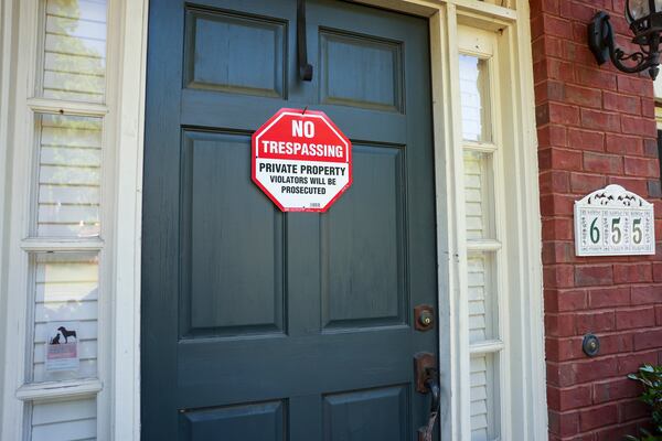 No trespassing signs are shown at the home at 655 Goldenwood Court, in the Broadlands subdivision, Monday, April 29, 2024, in Powder Springs, Ga. The home was previously squatted in by a man who was arrested last week. (Jason Getz / AJC)
