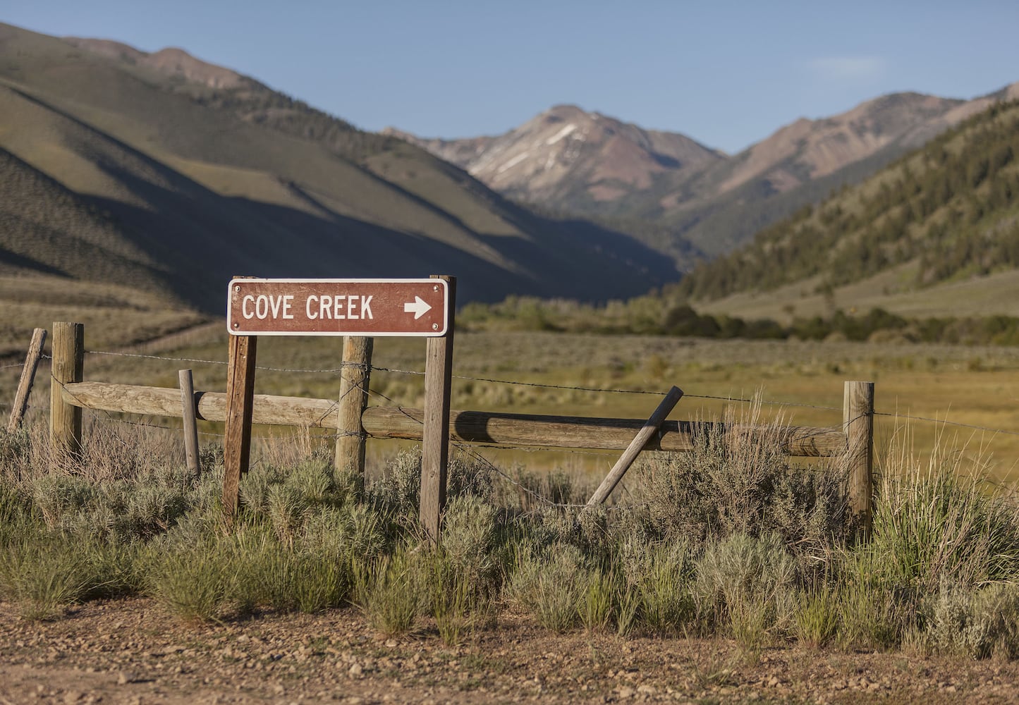 500-acre property has log cabins, mountain views