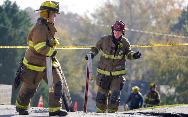 Gwinnett County firefighters continued working at First Pentecostal Church of Buford on Friday. Ben Hendren for the Atlanta Journal-Constitution