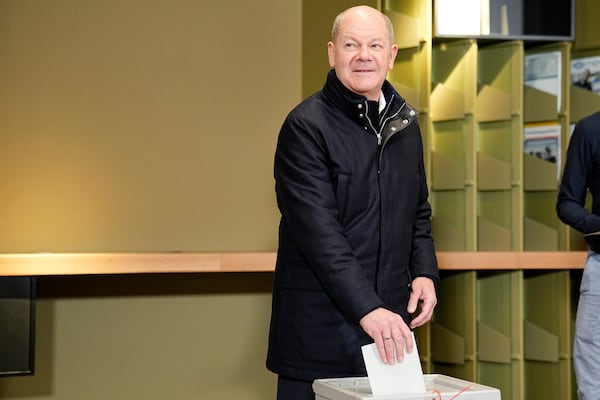 German Chancellor Olaf Scholz casts his vote at a polling station in Berlin, Germany, Sunday, Feb. 23, 2025, during the German national election. (AP Photo/Martin Meissner)