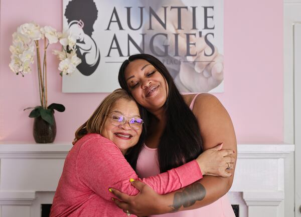 (Left to right) Alveda King hugs Angela Stanton-King at Auntie Angie’s House on Friday, March 24, 2023.  Stanton-King says King who is also her godmother and senior advisor gave her a a job when she got out of prison when no one else would. (Natrice Miller/natrice.miller@ajc.com)