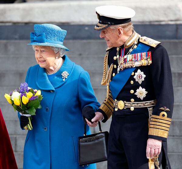 Queen Elizabeth II and Prince Philip, Duke of Edinburgh hold hands as they leave a Service of Commemoration to mark the end of combat operations in Afghanistan at St Paul's Cathedral on March 13, 2015 in London, England. (Photo by Max Mumby/Indigo/Getty Images)