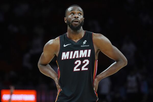 Miami Heat forward Andrew Wiggins (22) looks up at the scoreboard as the Heat fall behind the LA Clippers at the end of the second half of an NBA basketball game, Wednesday, March 12, 2025, in Miami. (AP Photo/Marta Lavandier)