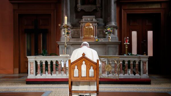 Pope Francis prays inside St Mary's Pro Cathedral during his visit to Dublin, Ireland, Saturday, Aug. 25, 2018.