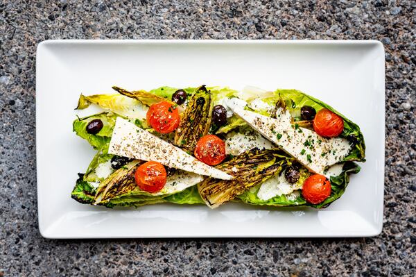 Grilled baby gem salad at Drift Fish House and Oyster Bar. CONTRIBUTED BY HENRI HOLLIS