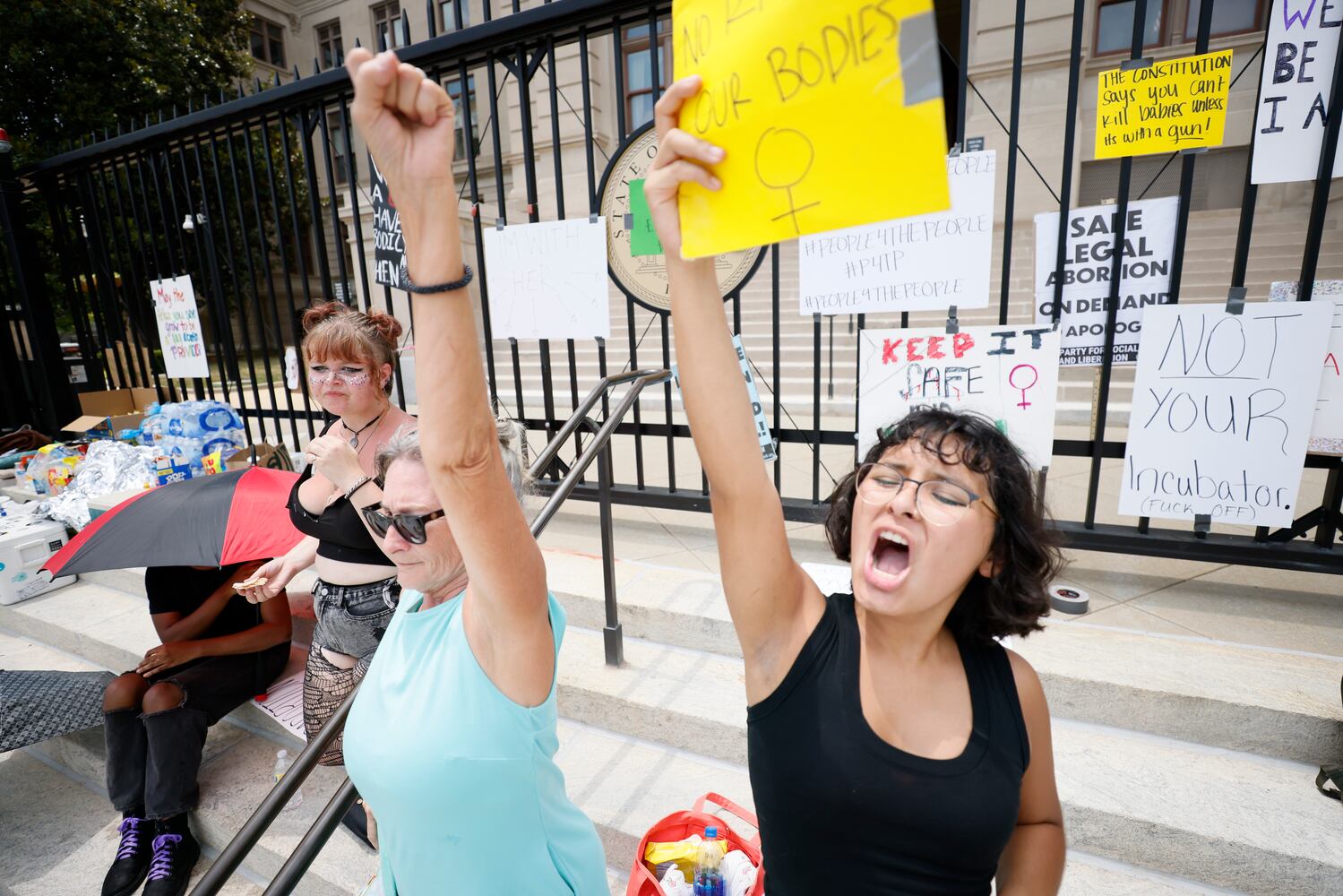 Miranda Gomez, right, and Dana Kruetzffeldt rally with abortion rights supporters at the Georgia Capitol on Sunday, June 26, 2022. Today marks day 3 of protest following the U. S. Supreme Court's overturning of Roe v Wade. Sunday, June 26, 2022. Miguel Martinez /miguel.martinezjimenez@ajc.com