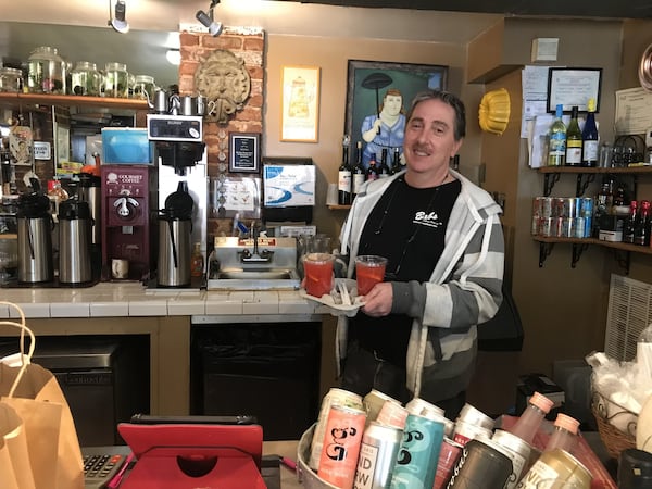 Chef-owner Randy Adler of Babs stands behind the counter of his Midtown restaurant, which marked its 16th anniversary April 1. There were no customers to celebrate. Still, the career chef is upbeat, with a plan to weather the chaos caused by the pandemic. LIGAYA FIGUERAS / LFIGUERAS@AJC.COM