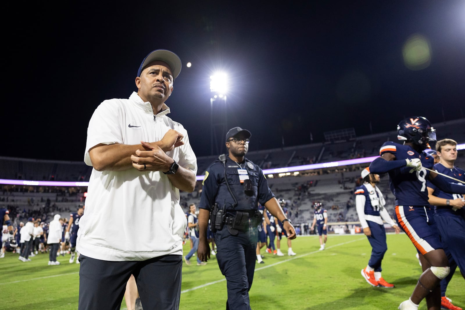 Virginia head coach Tony Elliott walks toward the sideline after losing an NCAA college football game against Maryland, Saturday, Sept. 14, 2024, in Charlottesville, Va. (AP Photo/Mike Kropf)