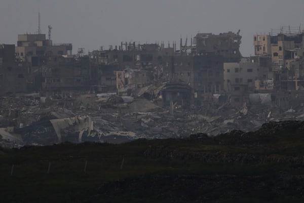 Buildings destroyed during the Israeli attack are seen in the Gaza Strip from southern Israel, Thursday, March 20, 2025. (AP Photo/Leo Correa)