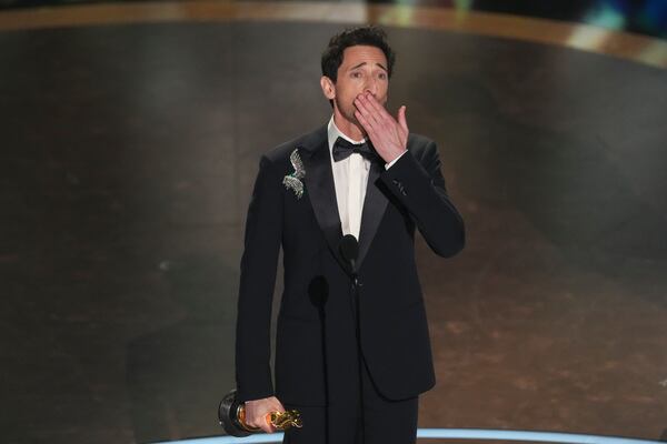 Adrien Brody accepts the award for best performance by an actor in a leading role for "The Brutalist" during the Oscars on Sunday, March 2, 2025, at the Dolby Theatre in Los Angeles. (AP Photo/Chris Pizzello)