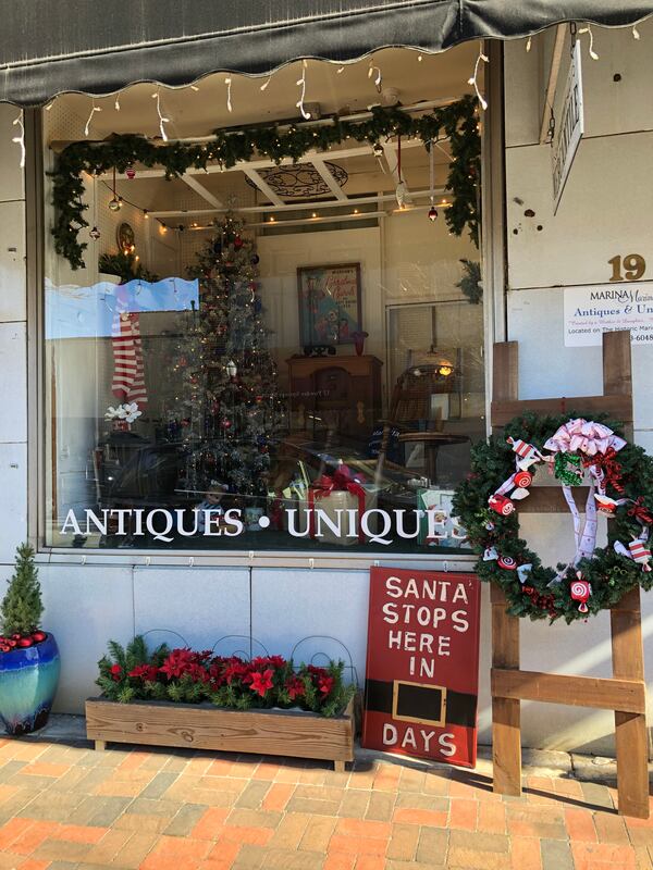 Marina Marina Antiques won Best at Night in the Marietta Marietta Window Walk design contest.