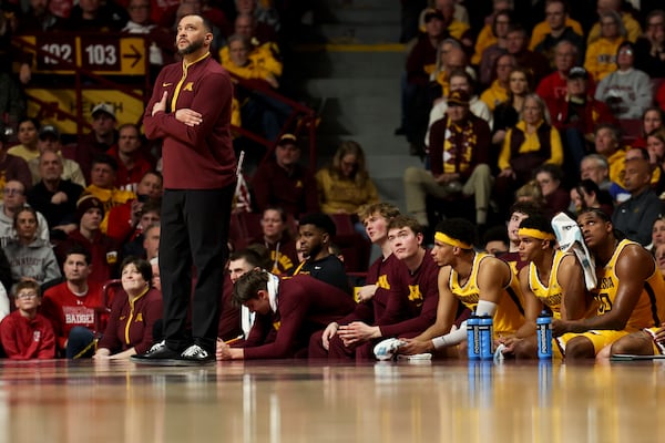 FILE - Minnesota head coach Ben Johnson looks to the scoreboard during the first half of an NCAA college basketball game against Wisconsin, Wednesday, March 5, 2025, in Minneapolis. (AP Photo/Ellen Schmidt, File)