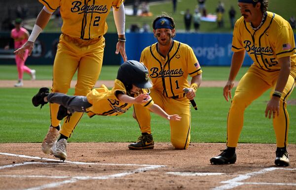 A young Savannah Bananas fan hits a home run during an event before the first game of a three-game series at Coolray Field.