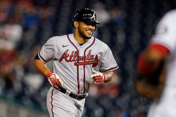 Atlanta Braves' Huascar Ynoa smiles as he runs the bases for his grand slam during the sixth inning of baseball game against the Washington Nationals at Nationals Park, Tuesday, May 4, 2021, in Washington. (AP Photo/Alex Brandon)