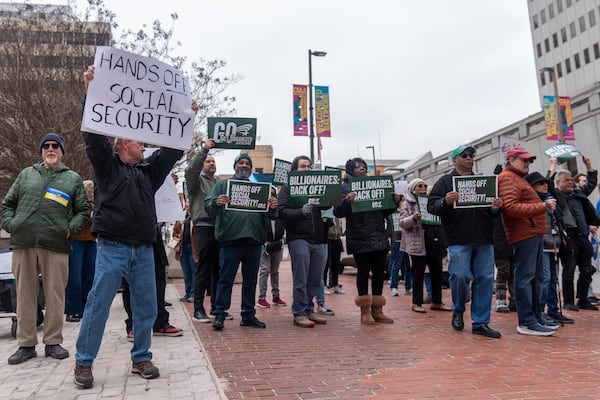 Demonstrators gather outside of the Edward A. Garmatz United States District Courthouse in Baltimore, on Friday, March 14, 2025, before a hearing regarding the Department of Government Efficiency's access to Social Security data. (AP Photo/Stephanie Scarbrough)