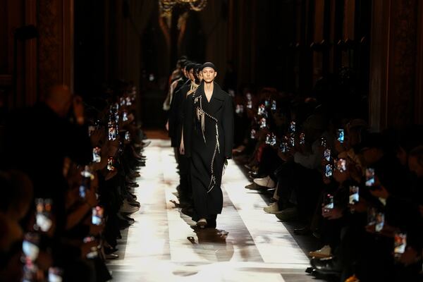 Models wear creations as part of the Dries Van Noten Fall/Winter 2025-2026 Womenswear collection presented in Paris, Wednesday, March 5, 2025. (Photo by Scott A Garfitt/Invision/AP)