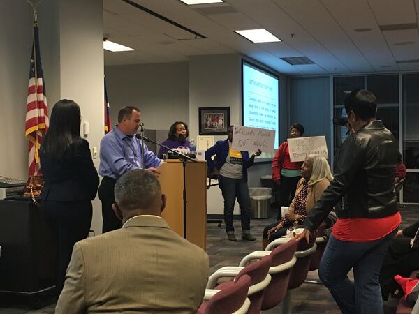 A meeting between Gwinnett County Commissioner Tommy Hunter and the Gwinnett NAACP quickly devoled Tuesday night, as NAACP members shouted at each other and the commissioner. TYLER ESTEP / TYLER.ESTEP@AJC.COM