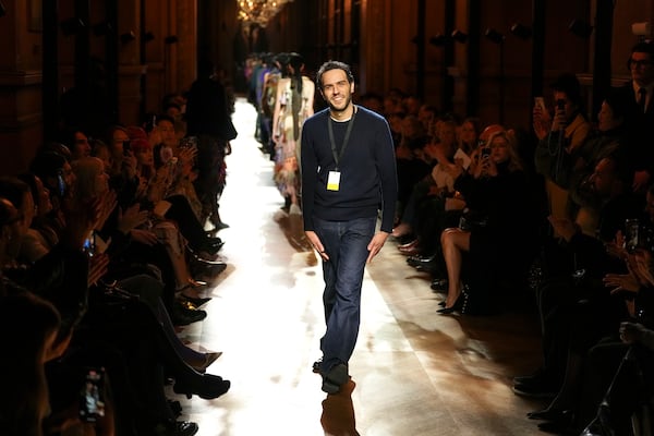 Designer Julian Klausner accepts applause after the Dries Van Noten Fall/Winter 2025-2026 Womenswear collection presented in Paris, Wednesday, March 5, 2025. (Photo by Scott A Garfitt/Invision/AP)