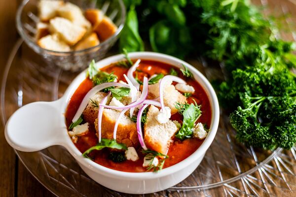 Gazpacho From a Can of Tomatoes is topped here with croutons, goat cheese, fresh herbs and red onion, but choices for toppings range from sour cream to avocados to chilled seafood. CONTRIBUTED BY HENRI HOLLIS