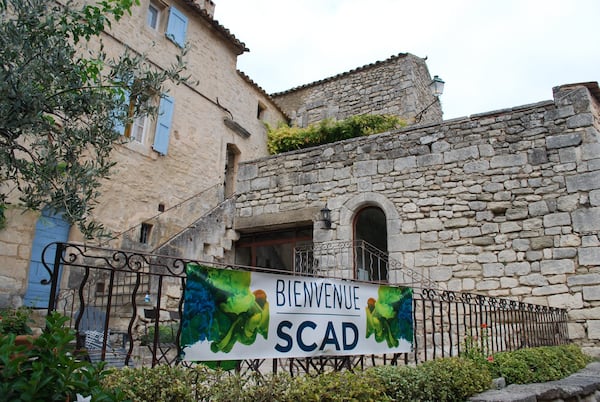 A banner welcomes visitors to the Savannah College of Art and Design’s campus in Lacoste, France. ALAN JUDD/ajudd@ajc.com