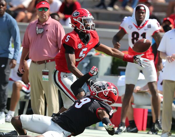 Georgia defensive back Amir Speed breaks up a pass to wide receiver Adonai Mitchell during the G-Day Game Saturday, April 17, 2021, at Sanford Stadium in Athens.  (Curtis Compton / Curtis.Compton@ajc.com)