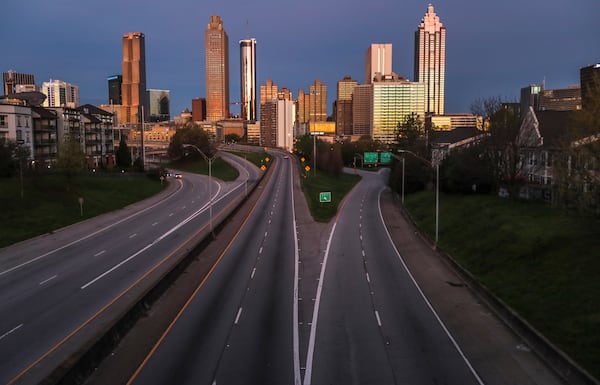 March 26, 2020 Atlanta: A nearly empty John Lewis Freedom Parkway on Thursday, March 26, 2020. The impact of the coronavirus in Georgia was evident everywhere on Thursday, March 26, 2020 - from less traveled streets, public service billboards and people staying home. Dr. Kathleen Toomey, the state public health commissioner, says the State of Georgia has several “hotspots” of outbreaks, including in Albany, Bartow County, Dublin and Rome. In “virtually all these cases,” at least some of the spread was linked to “large church services,” she said. In Dougherty County, for instance, the coronavirus outbreak has been traced to two funeral services in late February and early March. Toomey told clergy that churches, synagogues and mosques that have the technical capacity to offer online services should do so. “This is a short period of inconvenience and worry, but if we invest in this collectively as a community we can help stop this virus,” she said. JOHN SPINK/JSPINK@AJC.COM

