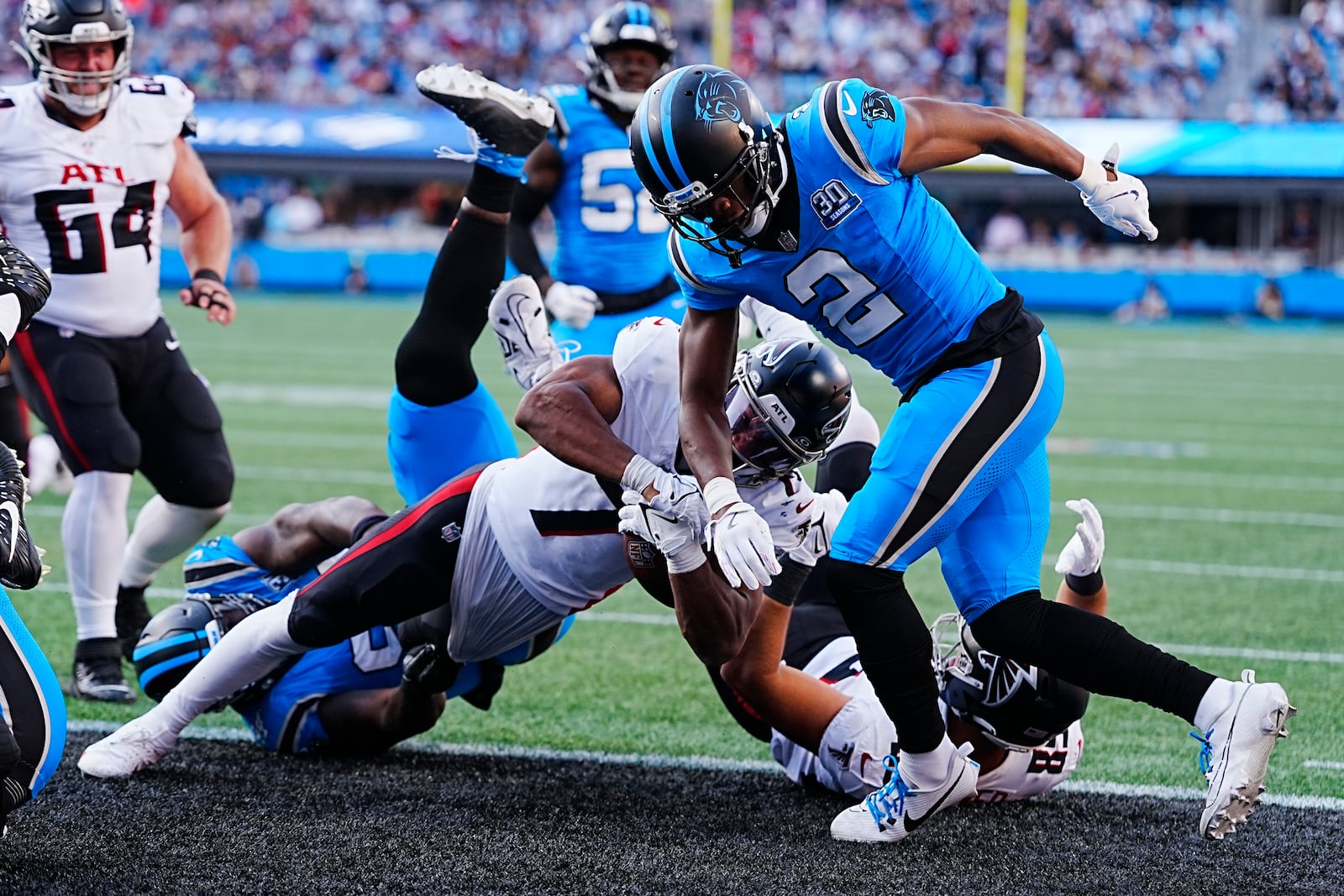 Atlanta Falcons running back Bijan Robinson (7) scores a touchdown in the first half of an NFL football game against the Carolina Panthers in Charlotte, N.C., Sunday, Oct. 13, 2024. (AP Photo/Rusty Jones)