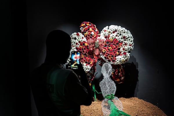 A visitor explores the international exhibit at the Dakar Biennale of Contemporary African Art in Dakar, Senegal, Friday, Nov. 8, 2024. (AP Photo/Annika Hammerschlag)