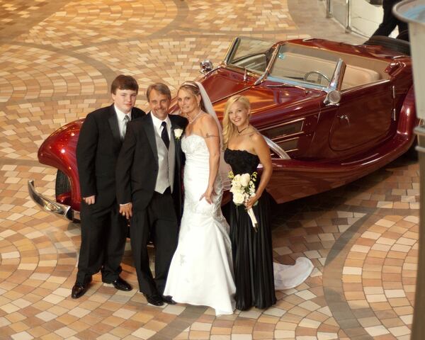 Bill McConnell and his family, wife Misty, daughter Ciarra and stepson Peyton, are embarking on Royal Caribbean’s seven-day cruise coined “Total Eclipse Cruise.” In this 2013 photo, Bill and Misty were getting married on a Royal Caribbean cruise. CONTRIBUTED