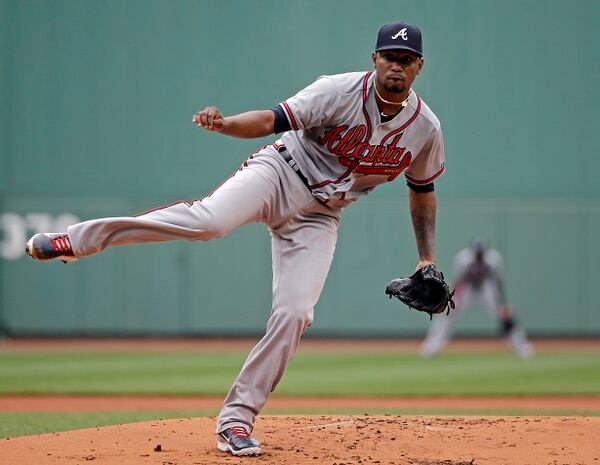 Atlanta Braves starting pitcher Julio Teheran delivers to the Boston Red Sox in the first inning of a baseball game at Fenway Park Tuesday, June 16, 2015, in Boston. (AP Photo/Elise Amendola)