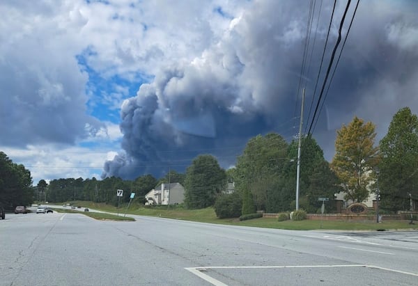 Bobby Jo Greaver-Machic lives in Conyers and photographed the view of the chemical plant fire plume from her car Sunday.