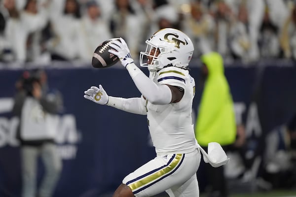 Georgia Tech linebacker E.J. Lightsey (2) runs in a touchdown celebrating after an interception during the first half of an NCAA college football game North Carolina State, Thursday, Nov. 21, 2024, in Atlanta. (AP Photo/Brynn Anderson)