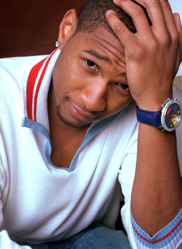 Usher poses in the W Hotel at Union Square in New York, April 1, 2002. (AP Photo/Jim Cooper)