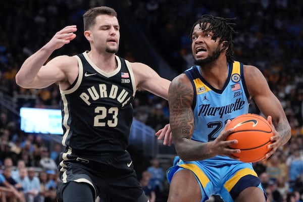 Marquette's David Joplin tries to get past Purdue's Camden Heide during the first half of an NCAA college basketball game Tuesday, Nov. 19, 2024, in Milwaukee. (AP Photo/Morry Gash)