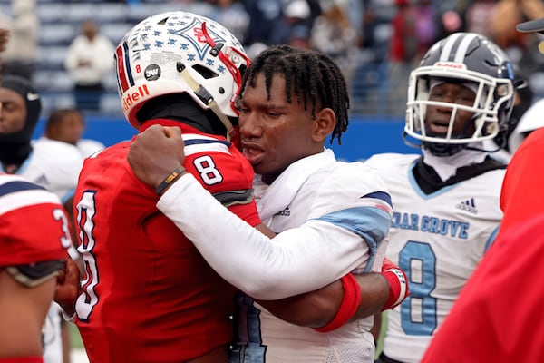 Sandy Creek linebacker Marcellius Pulliam (8) greets Cedar Grove quarterback Elliott Colson (11) after their game in the GHSA Class 3A finals, at Center Parc Stadium, Saturday, December 10, 2022, in Atlanta. Sandy Creek won 21-17. (Jason Getz / Jason.Getz@ajc.com)