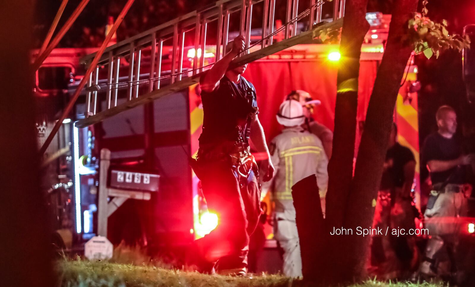 Crews with Atlanta Fire Rescue are on the scene of an early Tuesday morning fatal fire on Harvel Drive. JOHN SPINK / JSPINK@AJC.COM