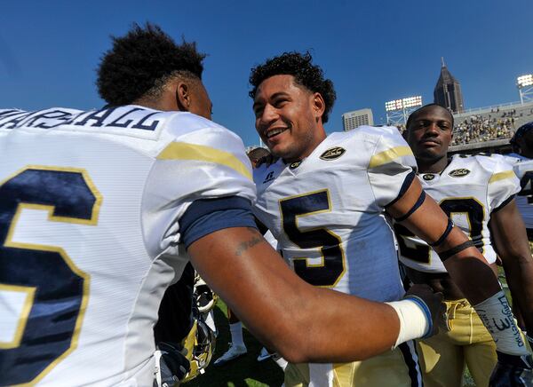 Atlanta, Ga. -- Georgia Tech senior QB Justin Thomas (5) congratulates sophomore QB TaQuon Marshall  (16) after their 38-35 win over Duke Saturday, October 29, 2016. SPECIAL/Daniel Varnado