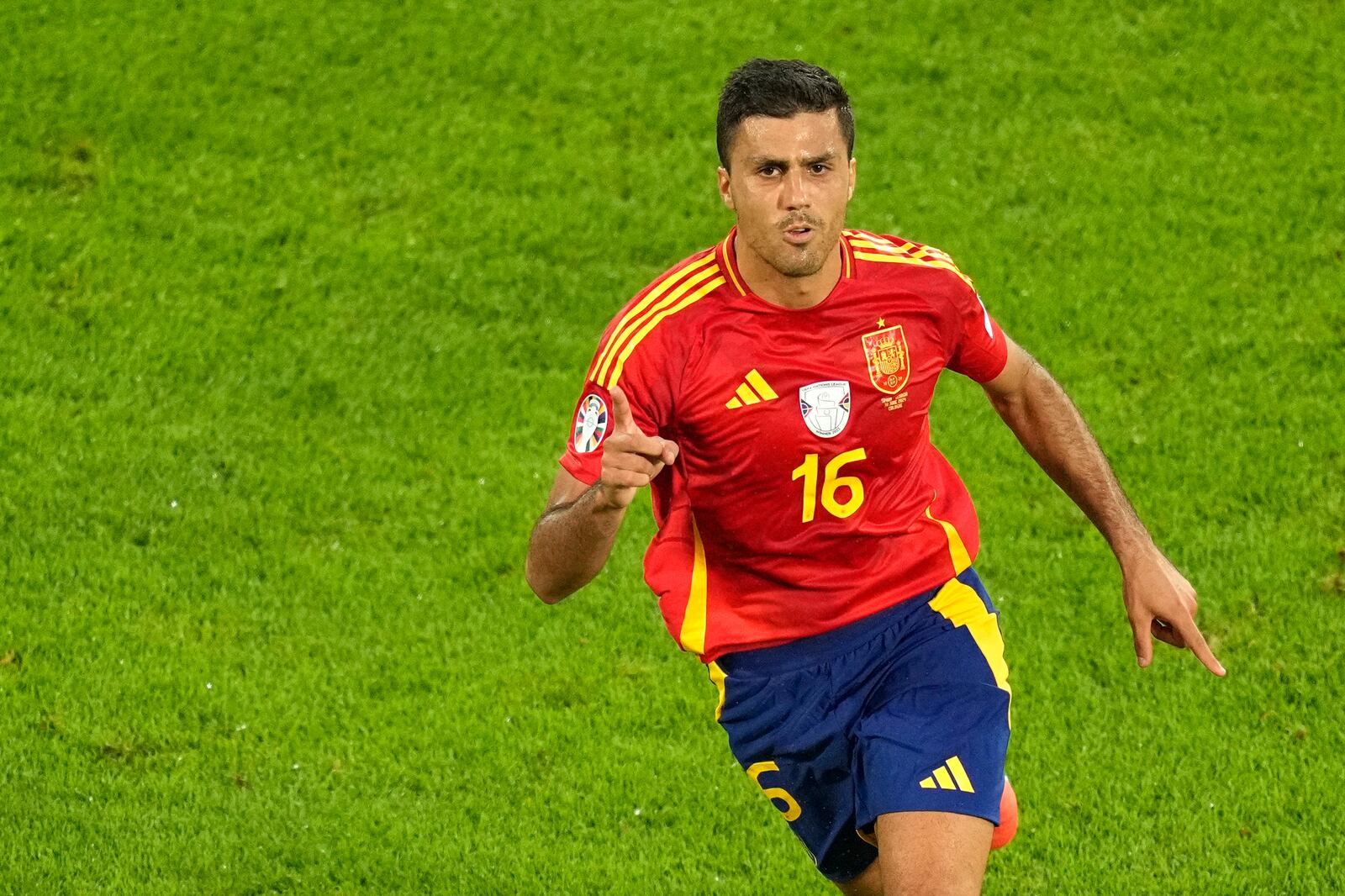 FILE - Spain's Rodri celebrates after scoring his side's opening goal during a round of sixteen match against Georgia at the Euro 2024 soccer tournament in Cologne, Germany, Sunday, June 30, 2024. (AP Photo/Andreea Alexandru, File)